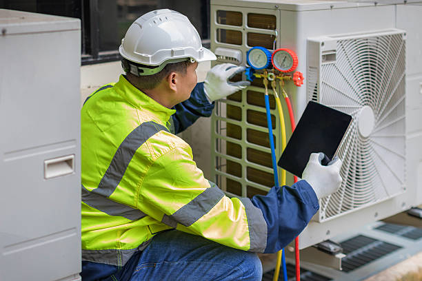 Professional Air Conditioning Repair technician working in Devens, MA